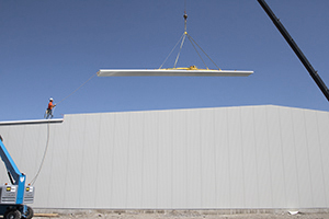 Flying 55 foot insulated roof panel at Wood's Powr-Grip. Flying 55 foot roof insulated panel at Wood's Powr-Grip.